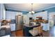 Updated kitchen with an island, stainless appliances, and granite countertops at 4455 Sirrocco Sw Ln, Lilburn, GA 30047