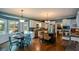 Spacious kitchen with stainless steel appliances, center island, and breakfast nook area at 4455 Sirrocco Sw Ln, Lilburn, GA 30047
