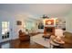 Comfortable living room with fireplace, built-ins, and natural light at 4455 Sirrocco Sw Ln, Lilburn, GA 30047