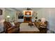 Spacious living room featuring a brick fireplace and built-in shelving at 4455 Sirrocco Sw Ln, Lilburn, GA 30047