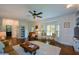 Bright and open living room with a bay window and hardwood floors at 4455 Sirrocco Sw Ln, Lilburn, GA 30047