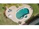 Aerial view of the in-ground pool with an attached spa, and a large patio area at 4455 Sirrocco Sw Ln, Lilburn, GA 30047