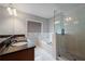 An elegant bathroom featuring granite countertops, dual sinks, a separate shower, and a large soaking tub at 1016 Manchester Way # 43, Roswell, GA 30075