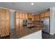 Stylish kitchen with stainless steel appliances, granite countertops, and ample cabinet space at 1016 Manchester Way # 43, Roswell, GA 30075
