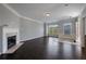 Bright living room featuring a fireplace, hardwood floors, and large windows providing plenty of natural light at 1016 Manchester Way # 43, Roswell, GA 30075