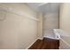 A walk-in closet with hardwood floors, shelving for clothes and storage, and good lighting at 1016 Manchester Way # 43, Roswell, GA 30075