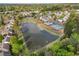 A panoramic aerial view of community lakes, swimming pool, tennis courts, and residential homes at 4454 Kentland Dr, Acworth, GA 30101