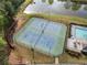 Aerial view of two community tennis courts adjacent to the pool with lights for nighttime play at 4454 Kentland Dr, Acworth, GA 30101