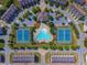 Aerial view of community featuring a clubhouse, pool, and tennis courts amidst landscaped grounds at 5449 Festival Ave, Fairburn, GA 30213