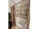 Bathroom featuring shower and tub with tile surround, perfect for relaxation and functionality at 5449 Festival Ave, Fairburn, GA 30213