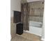 Bathroom featuring shower and tub with tile surround, perfect for relaxation and functionality at 5449 Festival Ave, Fairburn, GA 30213