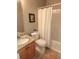 Well-lit bathroom featuring a granite countertop and shower-tub combo at 5449 Festival Ave, Fairburn, GA 30213