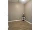 Minimalist bedroom with hard surface flooring and neutral walls with bright-white trim at 5449 Festival Ave, Fairburn, GA 30213
