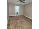 Bright bedroom featuring a ceiling fan and filled with natural light, perfect for relaxing at 5449 Festival Ave, Fairburn, GA 30213