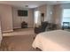 Spacious bedroom featuring plush carpeting, a large window, and ample space for furniture at 5449 Festival Ave, Fairburn, GA 30213