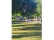 Common green space with mature landscaping and walking paths at 5449 Festival Ave, Fairburn, GA 30213