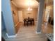 Cozy dining area offering a glimpse of the entry and living room at 5449 Festival Ave, Fairburn, GA 30213