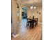 Eat-in dining area featuring wood-look tile flooring, table with seating, and modern light fixture at 5449 Festival Ave, Fairburn, GA 30213