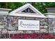 Stone community sign for Renaissance at Southpark with landscaped flowerbeds at 5449 Festival Ave, Fairburn, GA 30213
