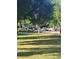 Grassy community park with trees, manicured landscaping, and seating area at 5449 Festival Ave, Fairburn, GA 30213