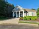 Exterior shot showcasing meticulously manicured landscaping and architecture of this community clubhouse at 5449 Festival Ave, Fairburn, GA 30213