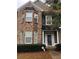 Charming brick two-story home featuring manicured landscaping and inviting front porch at 5449 Festival Ave, Fairburn, GA 30213