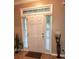 Front door with transom window and sidelights, offering plenty of natural light at 5449 Festival Ave, Fairburn, GA 30213