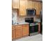 Bright kitchen featuring stainless appliances, granite countertops and stylish tile backsplash at 5449 Festival Ave, Fairburn, GA 30213