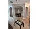 Open floorplan featuring archways and tile floors, leading to the dining area at 5449 Festival Ave, Fairburn, GA 30213