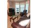 Spacious living area with comfortable seating, offering great natural light from bright windows at 5449 Festival Ave, Fairburn, GA 30213