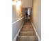 Carpeted stairway leading to the upper or lower levels of the home at 5449 Festival Ave, Fairburn, GA 30213