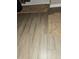 Stylish bathroom with wood-look tiled flooring and light brown rugs at 5449 Festival Ave, Fairburn, GA 30213