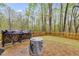 Relaxing outdoor patio featuring pavers, a grill, and woodpile, ideal for entertaining guests at 575 W Wayside Rd, Carrollton, GA 30116