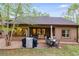 Backyard featuring a patio with outdoor furniture, grill, and grass at 575 W Wayside Rd, Carrollton, GA 30116