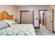 Bedroom with closet, neutral walls, carpet, and natural light at 575 W Wayside Rd, Carrollton, GA 30116