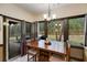 Dining area with large windows, backyard views and sliding glass doors to the patio at 575 W Wayside Rd, Carrollton, GA 30116