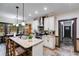 Modern kitchen with stone countertops, stainless steel appliances, and barstool seating at 575 W Wayside Rd, Carrollton, GA 30116