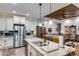 Spacious kitchen with an island, stainless steel appliances, and modern fixtures at 575 W Wayside Rd, Carrollton, GA 30116