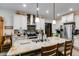 Open kitchen with stainless steel appliances, granite countertops and stone backsplash with an island at 575 W Wayside Rd, Carrollton, GA 30116