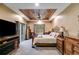 Spacious main bedroom with wood-paneled ceiling, backyard access and a television at 575 W Wayside Rd, Carrollton, GA 30116