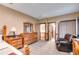 Spacious main bedroom featuring well-lit, a sitting area, and closet access at 575 W Wayside Rd, Carrollton, GA 30116