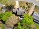 Bird's eye view of a home with a patio surrounded by green trees on a well-maintained property at 125 Ketton Xing, Johns Creek, GA 30097
