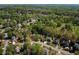 Extensive aerial view of homes surrounded by tree-lined streets in a well-maintained neighborhood at 125 Ketton Xing, Johns Creek, GA 30097