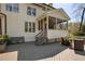 Charming backyard deck with a screened porch, outdoor seating, and tranquil views of the surrounding greenery at 125 Ketton Xing, Johns Creek, GA 30097