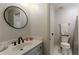 Clean and bright bathroom with modern fixtures, a white vanity, and tiled floors at 125 Ketton Xing, Johns Creek, GA 30097