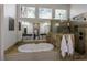 Luxurious bathroom with soaking tub, glass-enclosed shower, and elegant tile work at 125 Ketton Xing, Johns Creek, GA 30097