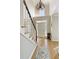 Bright foyer with hardwood floors, a staircase, and a view of the front door and chandelier at 125 Ketton Xing, Johns Creek, GA 30097