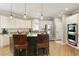 Gourmet kitchen with stainless steel appliances, custom cabinetry, and a large island perfect for entertaining at 125 Ketton Xing, Johns Creek, GA 30097