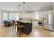 Open concept kitchen with stainless steel appliances, a kitchen island, and an adjacent breakfast nook at 125 Ketton Xing, Johns Creek, GA 30097