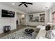 Open-concept living room with built-in shelving, stylish furniture, and a decorative rug creating an inviting ambiance at 125 Ketton Xing, Johns Creek, GA 30097